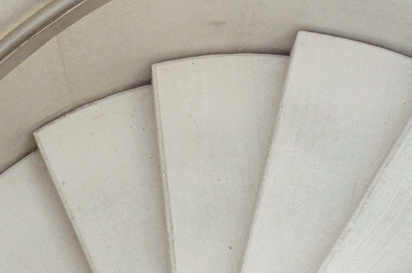 high angle photo of white spiral staircase
